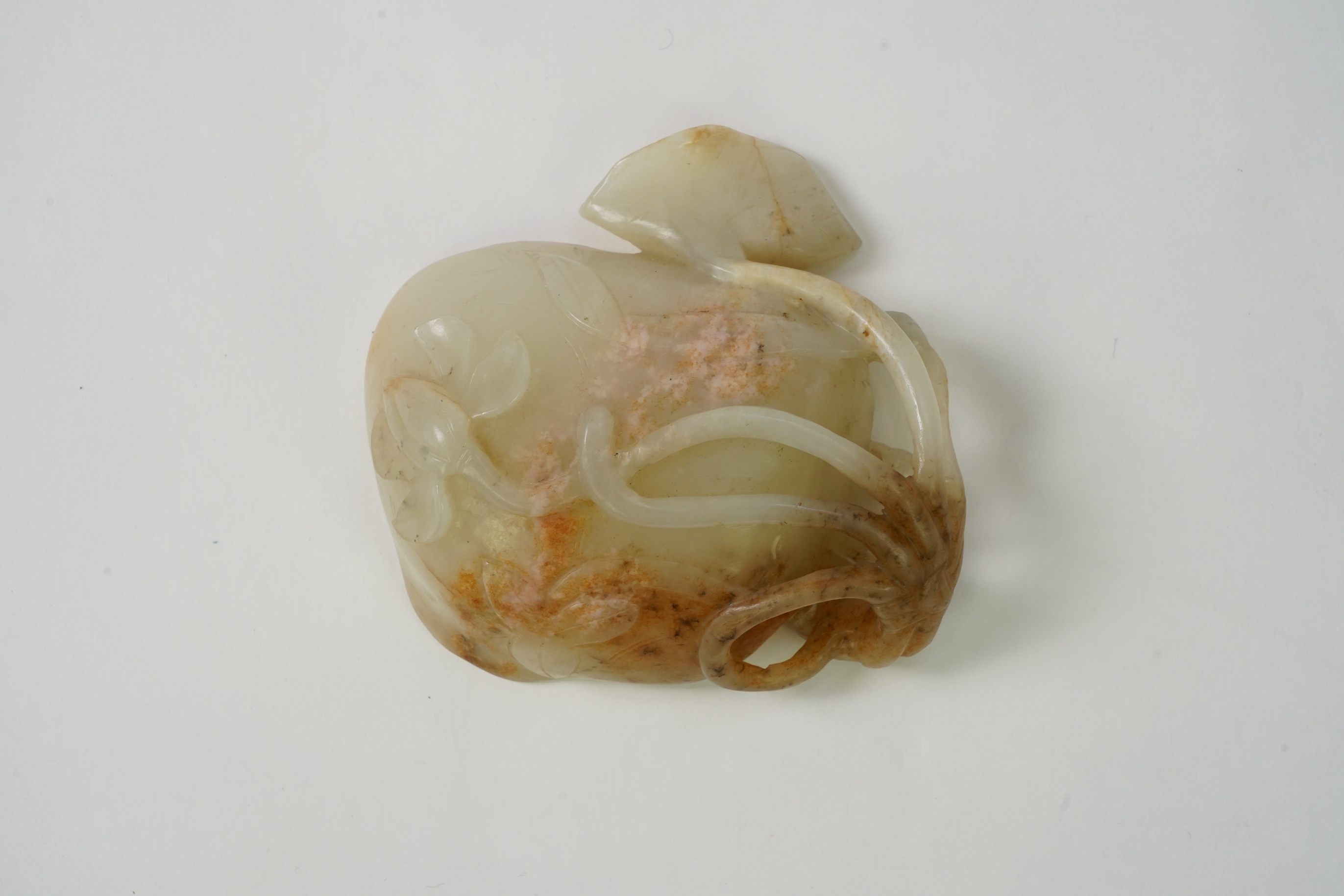 A Chinese pale celadon and russet jade brushwasher, Ming dynasty, 16th/17th century
